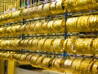 Gold fell to a weekly minimum on the growth of US dollar against euro after Draghi's speech